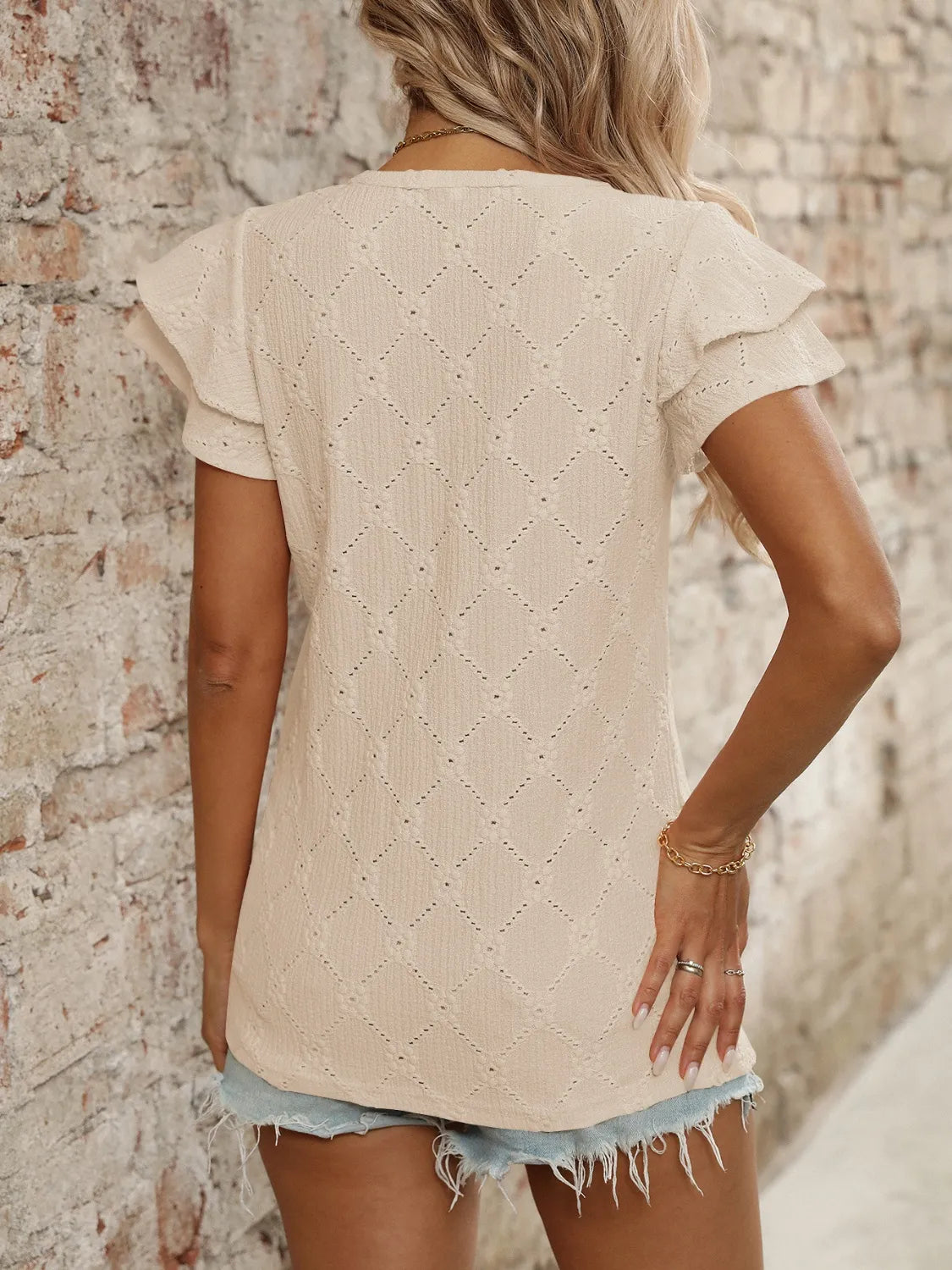 Eyelet V-Neck Ruffled Cap Sleeve Top - Premium Tops from Trendsi - Just $20.68! Shop now at Handbags Specialist Headquarter