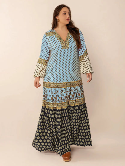 Plus Size Printed V-Neck Balloon Sleeve Maxi Dress - Premium Dresses from Trendsi - Just $52.99! Shop now at Handbags Specialist Headquarter