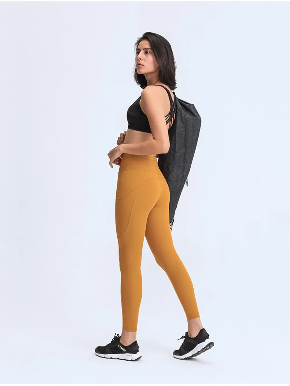 Millennia Wide Waistband Leggings with Pockets - Premium Leggings from Trendsi - Just $67.08! Shop now at Handbags Specialist Headquarter