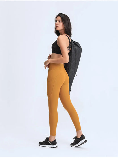 Millennia Wide Waistband Leggings with Pockets - Premium Leggings from Trendsi - Just $67.08! Shop now at Handbags Specialist Headquarter