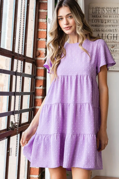 Heimish Full Size Swiss Dot Short Sleeve Tiered Dress - Premium Dresses from Trendsi - Just $39.99! Shop now at Handbags Specialist Headquarter