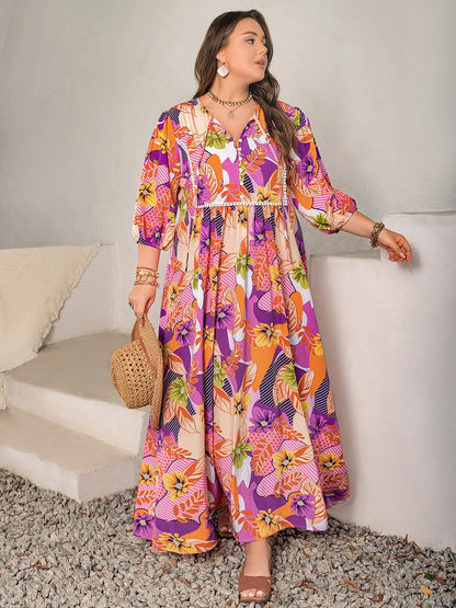 Plus Size Printed Tie Neck Maxi Dress - Premium Dresses from Trendsi - Just $46.99! Shop now at Handbags Specialist Headquarter