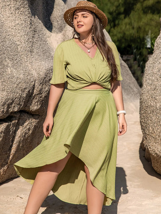 Plus Size V-Neck Half Sleeve Top and High-Low Skirt Set - Premium  from Trendsi - Just $47.99! Shop now at Handbags Specialist Headquarter