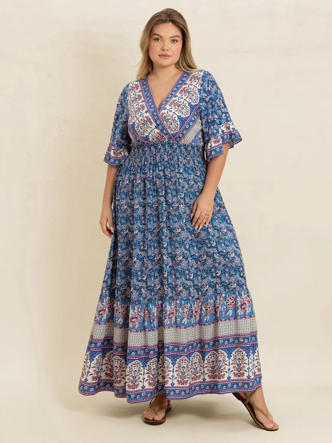 Plus Size Printed Surplice Half Sleeve Dress - Premium Dresses from Trendsi - Just $48.99! Shop now at Handbags Specialist Headquarter