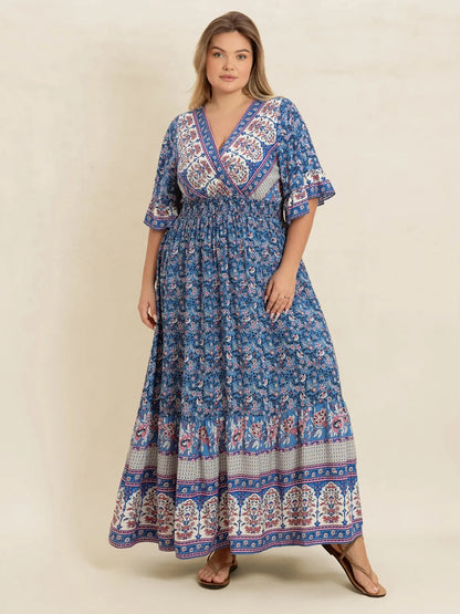 Plus Size Printed Surplice Half Sleeve Dress - Premium Dresses from Trendsi - Just $48.99! Shop now at Handbags Specialist Headquarter