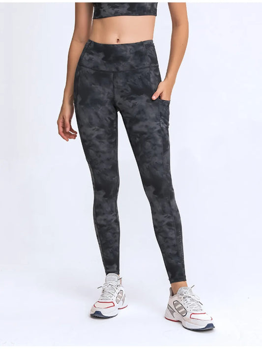 Millennia Wide Waistband Leggings with Pockets - Premium Leggings from Trendsi - Just $67.08! Shop now at Handbags Specialist Headquarter