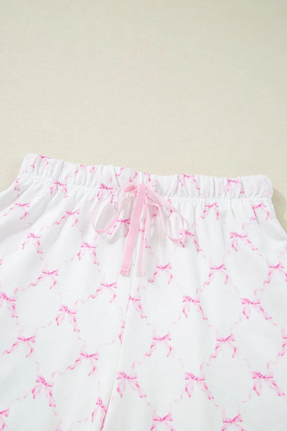 Bow Print Lettuce Trim Round Neck Top and Shorts Lounge Set - Premium Sleepwear from Trendsi - Just $32.14! Shop now at Handbags Specialist Headquarter