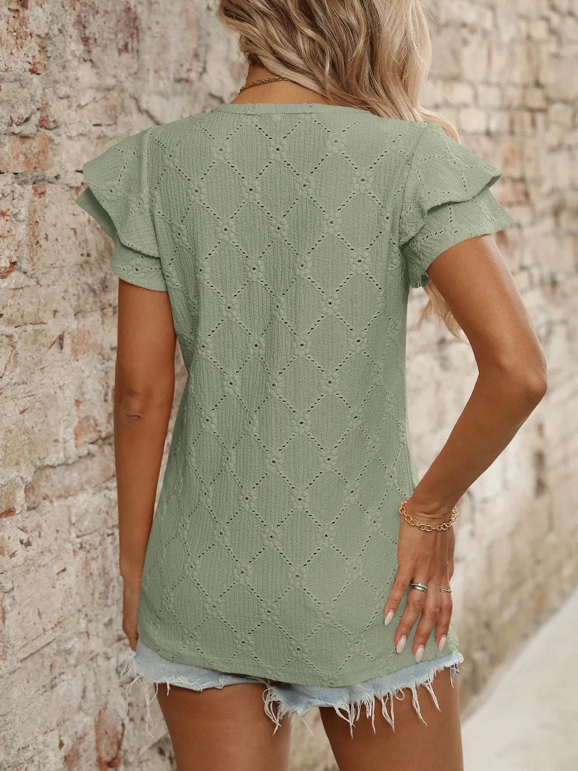 Eyelet V-Neck Ruffled Cap Sleeve Top - Premium Tops from Trendsi - Just $20.68! Shop now at Handbags Specialist Headquarter