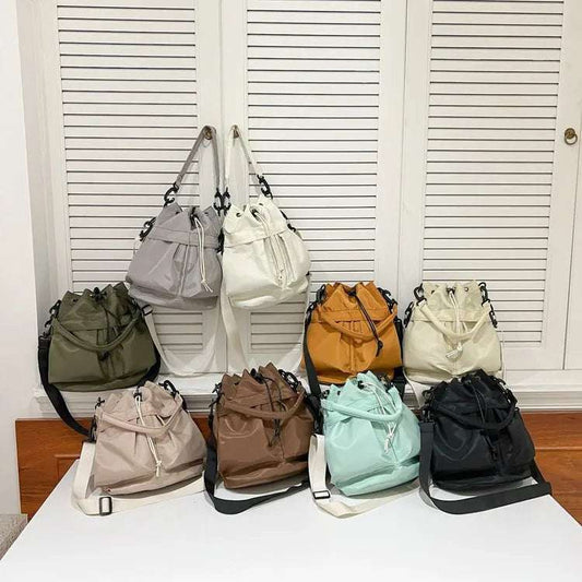 Drawstring Nylon Bucket Bag - Premium Crossbody Bag from Trendsi - Just $24.99! Shop now at Handbags Specialist Headquarter