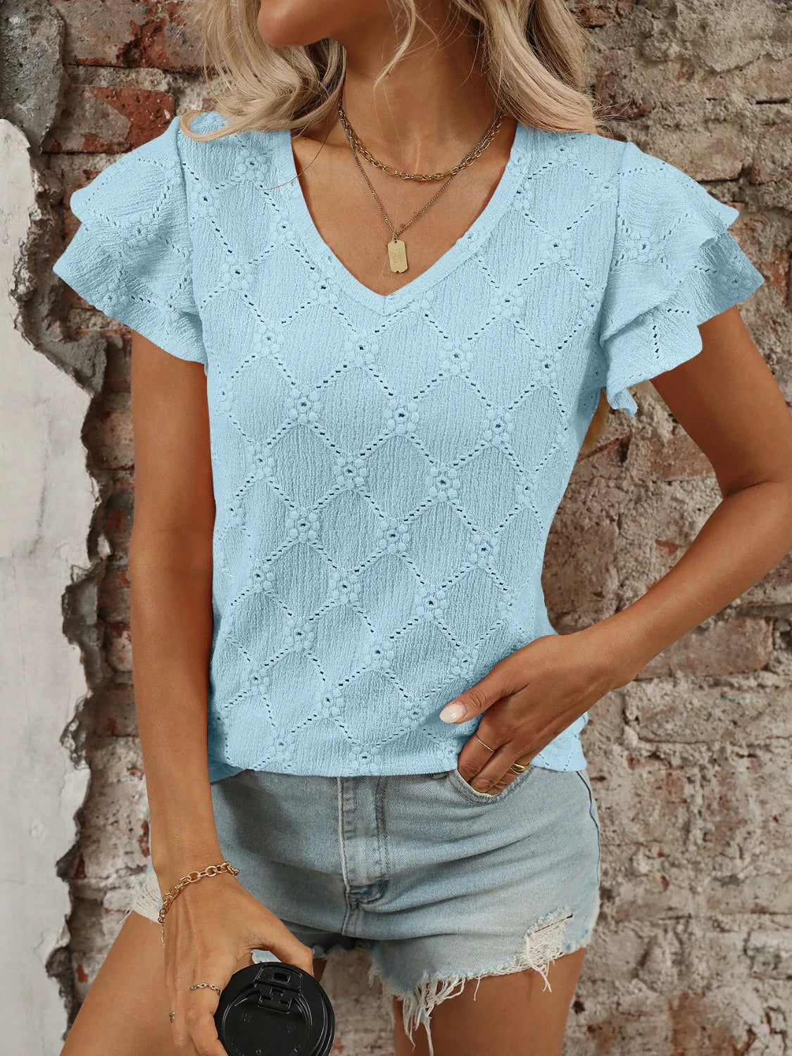 Eyelet V-Neck Ruffled Cap Sleeve Top - Premium Tops from Trendsi - Just $20.68! Shop now at Handbags Specialist Headquarter
