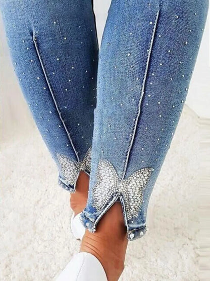 Rhinestone Butterfly Jeans with Pockets - Premium Women / Jeans & Denim from Trendsi - Just $35.10! Shop now at Handbags Specialist Headquarter