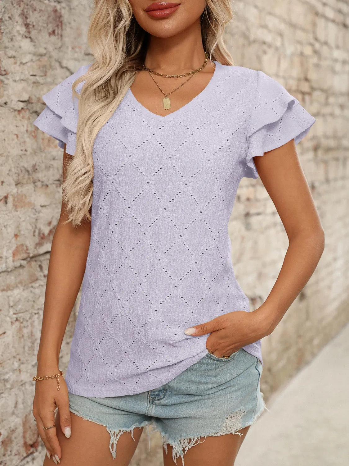 Eyelet V-Neck Ruffled Cap Sleeve Top - Premium Tops from Trendsi - Just $20.68! Shop now at Handbags Specialist Headquarter
