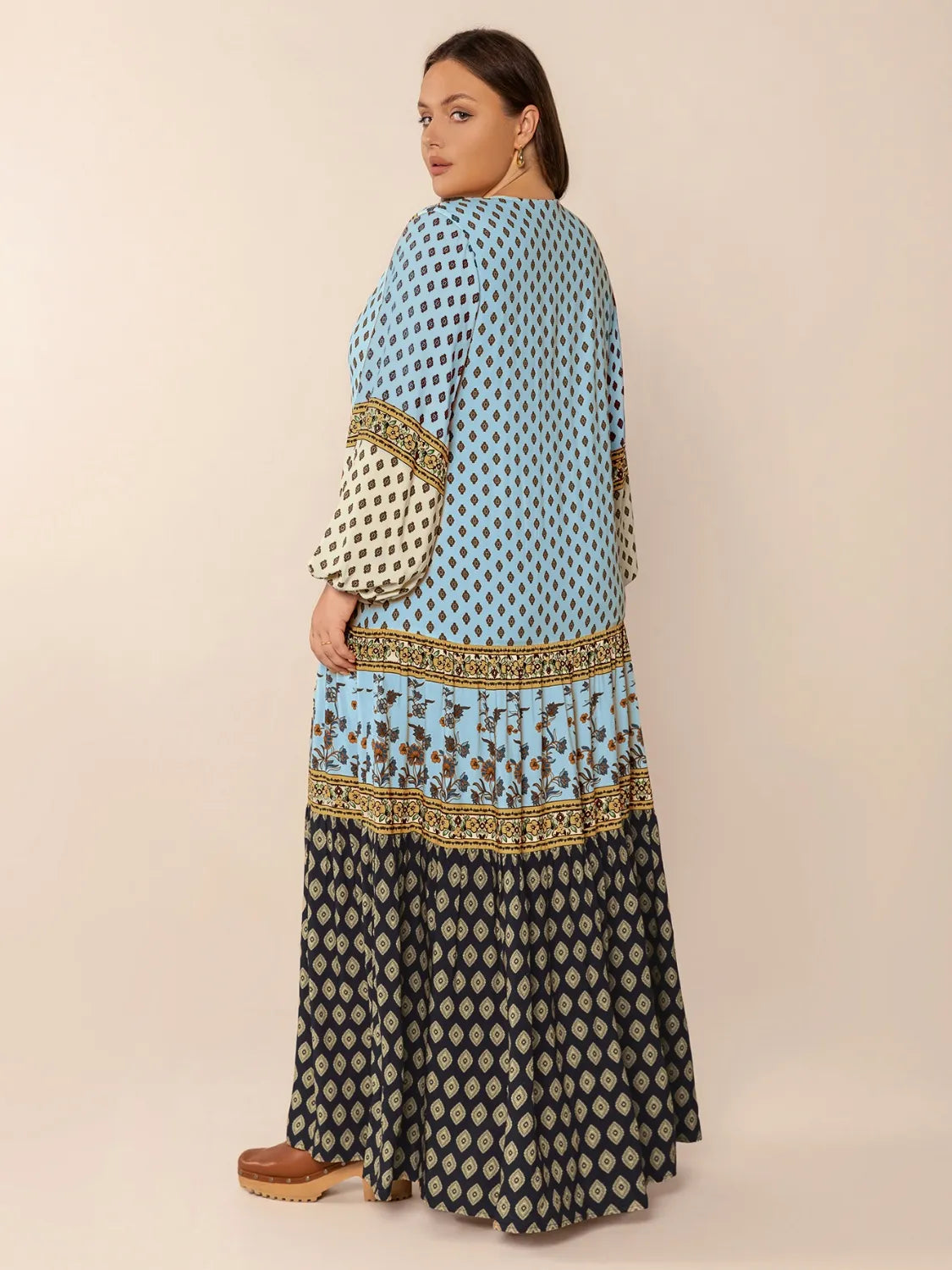 Plus Size Printed V-Neck Balloon Sleeve Maxi Dress - Premium Dresses from Trendsi - Just $52.99! Shop now at Handbags Specialist Headquarter