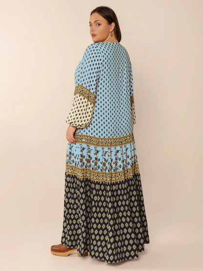 Plus Size Printed V-Neck Balloon Sleeve Maxi Dress - Premium Dresses from Trendsi - Just $52.99! Shop now at Handbags Specialist Headquarter