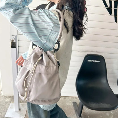 Drawstring Nylon Bucket Bag - Premium Crossbody Bag from Trendsi - Just $24.99! Shop now at Handbags Specialist Headquarter