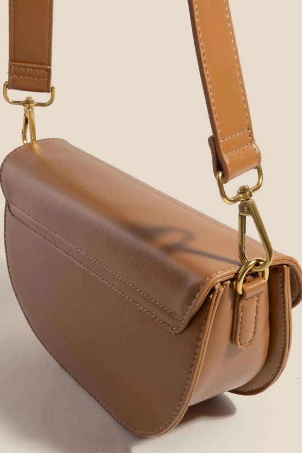 Fame Buckle Closure Crescent Faux Leather Crossbody Bag - Premium Crossbody Bag from Trendsi - Just $53.99! Shop now at Handbags Specialist Headquarter
