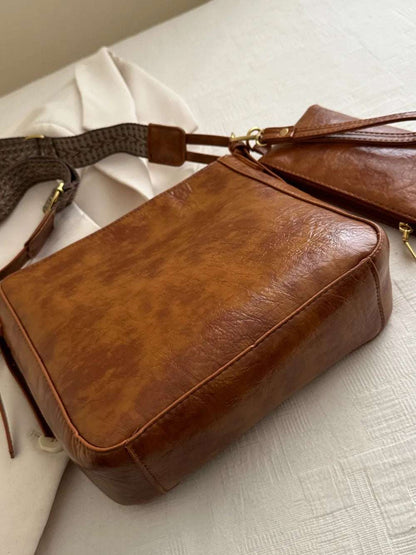 PU Leather Adjustable Strap Crossbody Bag with Pouch - Premium Crossbody Bag from Trendsi - Just $31.99! Shop now at Handbags Specialist Headquarter