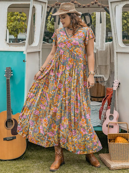 Plus Size Ruffled Printed Cap Sleeve Dress - Premium Dresses from Trendsi - Just $43.99! Shop now at Handbags Specialist Headquarter