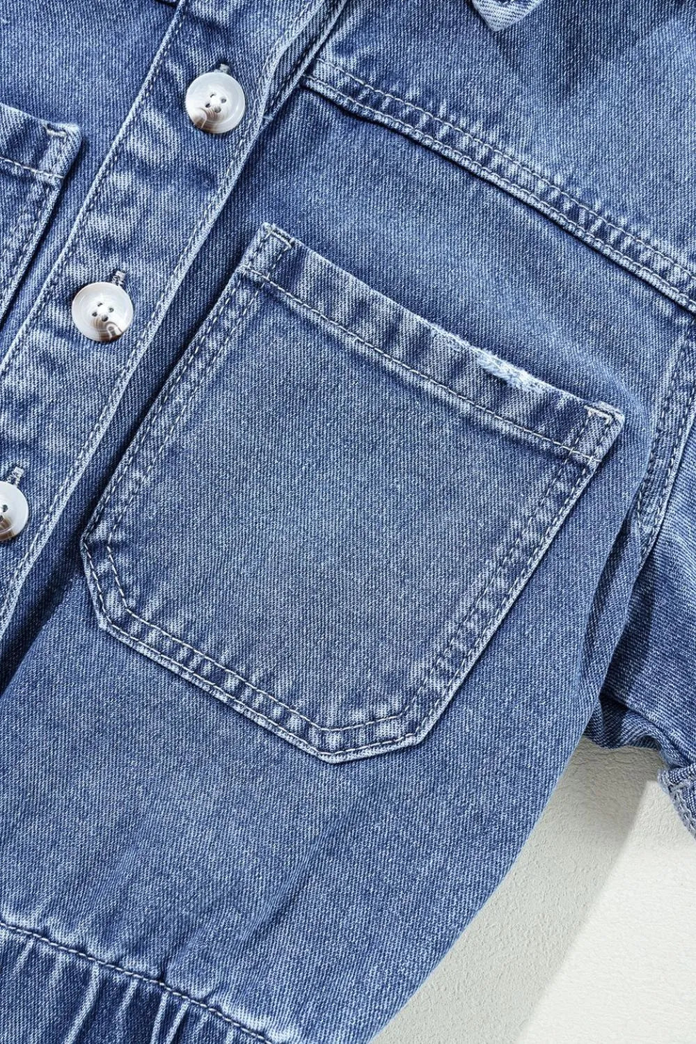 Chest Pocket Front Buttoned Folded Edge Denim Short Sleeve Romper - Premium Women / Jeans & Denim from Trendsi - Just $62.04! Shop now at Handbags Specialist Headquarter