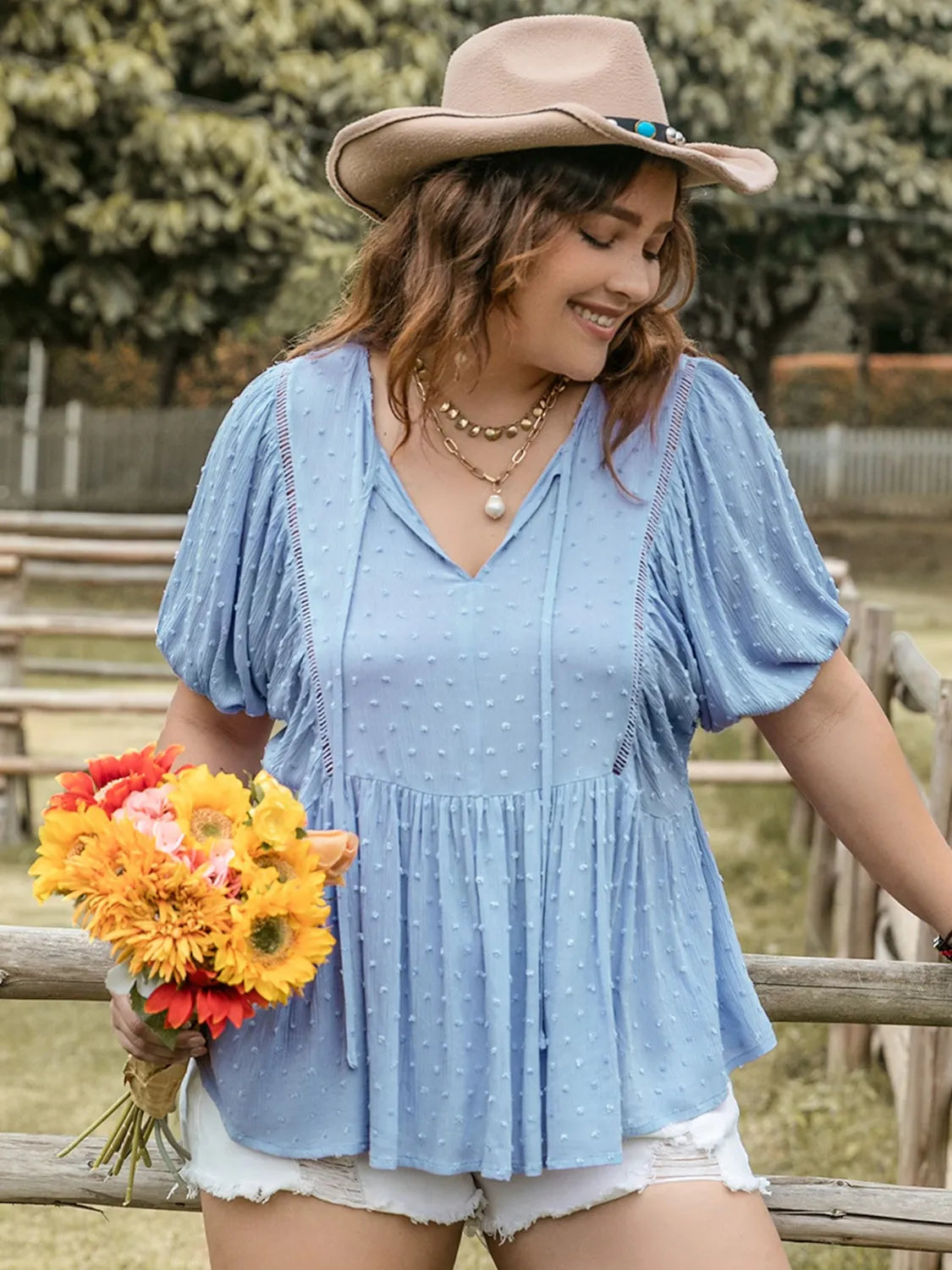 Plus Size Swiss Dot Tie Neck Short Sleeve Blouse - Premium Plus Size Shirts from Trendsi - Just $29.98! Shop now at Handbags Specialist Headquarter