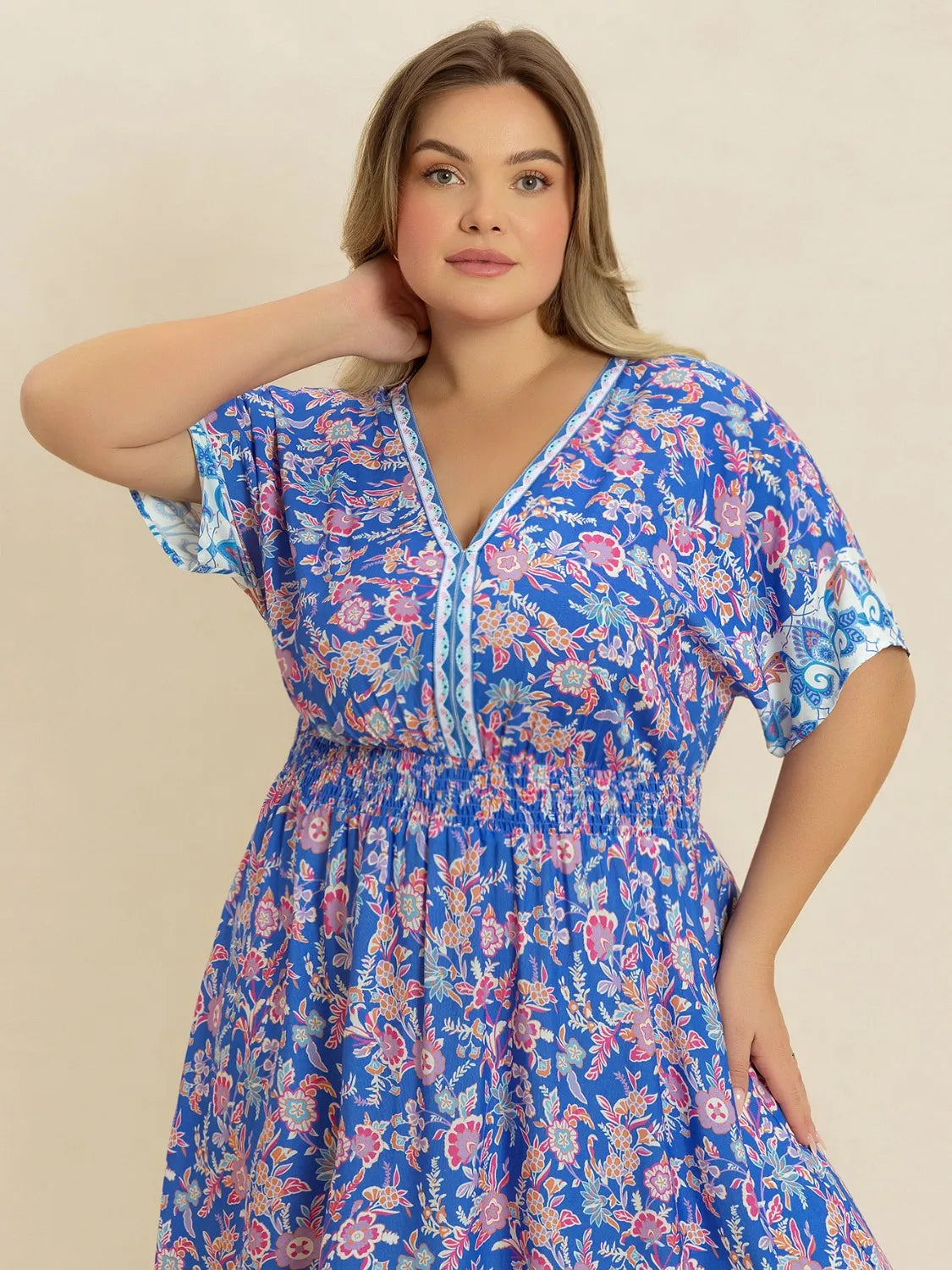 Plus Size Smocked Printed Half Sleeve Midi Dress - Premium Dresses from Trendsi - Just $43.99! Shop now at Handbags Specialist Headquarter