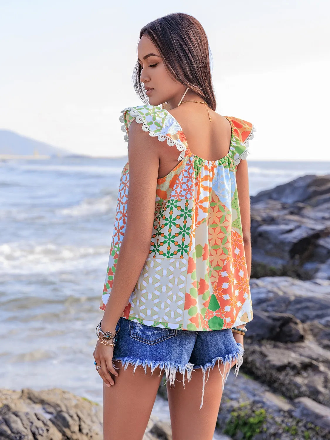 Lace Detail Printed Tie Neck Cap Sleeve Blouse - Premium Tops from Trendsi - Just $16.82! Shop now at Handbags Specialist Headquarter