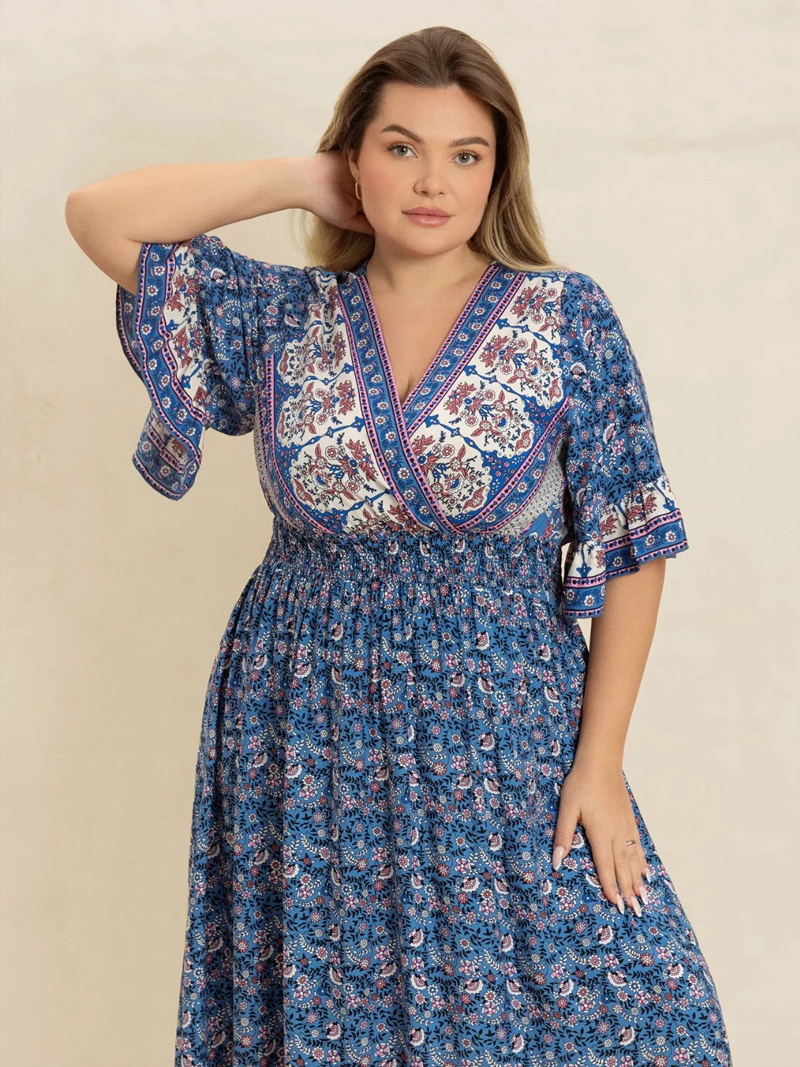 Plus Size Printed Surplice Half Sleeve Dress - Premium Dresses from Trendsi - Just $48.99! Shop now at Handbags Specialist Headquarter