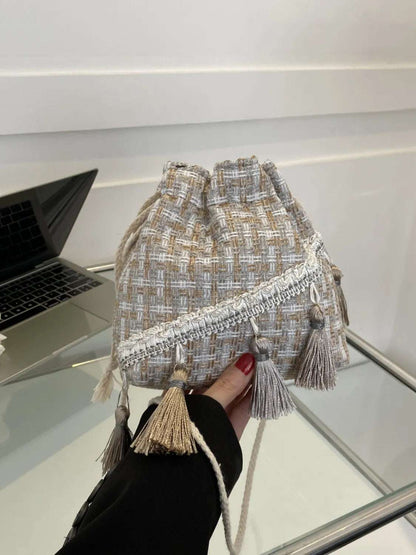 Tassel Trim Woven Bucket Crossbody Bag - Premium Crossbody Bag from Trendsi - Just $14.99! Shop now at Handbags Specialist Headquarter