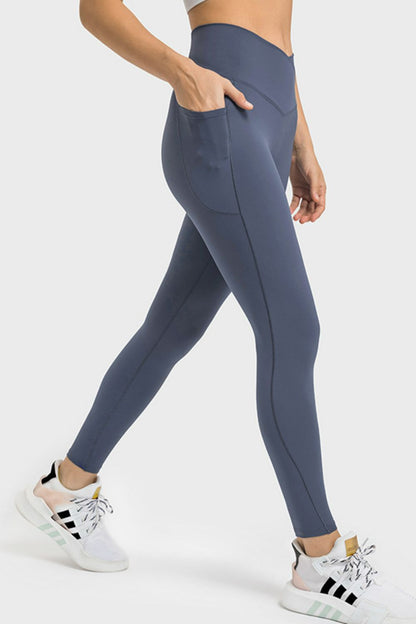 Millennia V-Waist Yoga Leggings with Pockets - Premium Leggings from Trendsi - Just $59.76! Shop now at Handbags Specialist Headquarter
