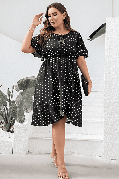 Plus Size Polka Dot Flutter Sleeve Dress - Premium Dresses from Trendsi - Just $46.99! Shop now at Handbags Specialist Headquarter
