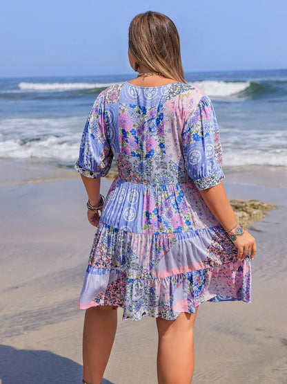 Plus Size Printed V-Neck Tiered Mini Dress - Premium Dresses from Trendsi - Just $33.99! Shop now at Handbags Specialist Headquarter