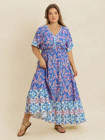 Plus Size Smocked Printed Half Sleeve Midi Dress - Premium Dresses from Trendsi - Just $43.99! Shop now at Handbags Specialist Headquarter