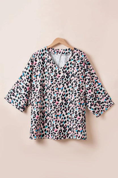 Plus Size Leopard V-Neck Three-Quarter Sleeve Blouse - Premium Plus Size Shirts from Trendsi - Just $24.32! Shop now at Handbags Specialist Headquarter