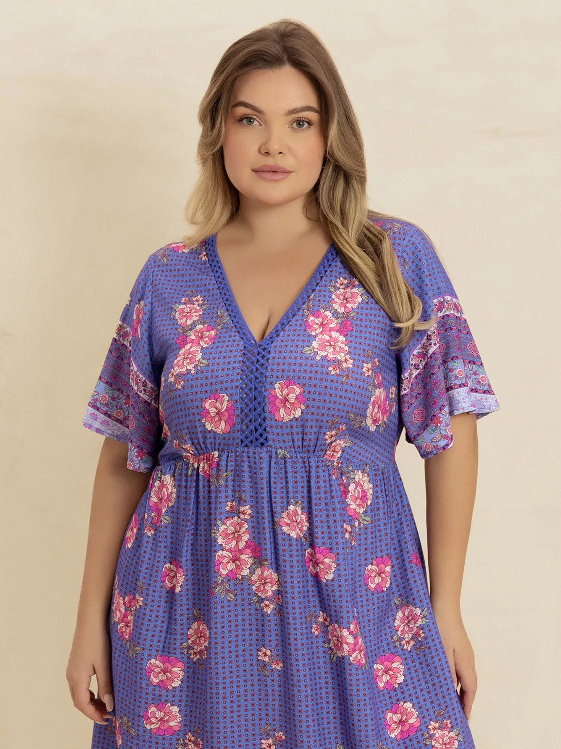 Plus Size Printed V-Neck Flutter Sleeve Dress - Premium Dresses from Trendsi - Just $38.99! Shop now at Handbags Specialist Headquarter
