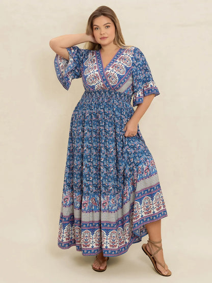 Plus Size Printed Surplice Half Sleeve Dress - Premium Dresses from Trendsi - Just $48.99! Shop now at Handbags Specialist Headquarter