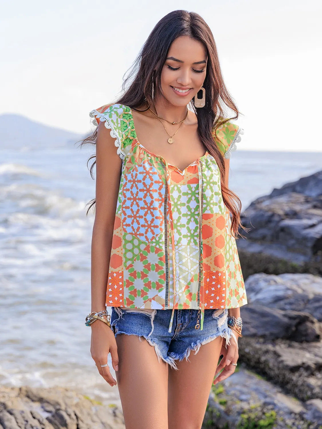 Lace Detail Printed Tie Neck Cap Sleeve Blouse - Premium Tops from Trendsi - Just $16.82! Shop now at Handbags Specialist Headquarter