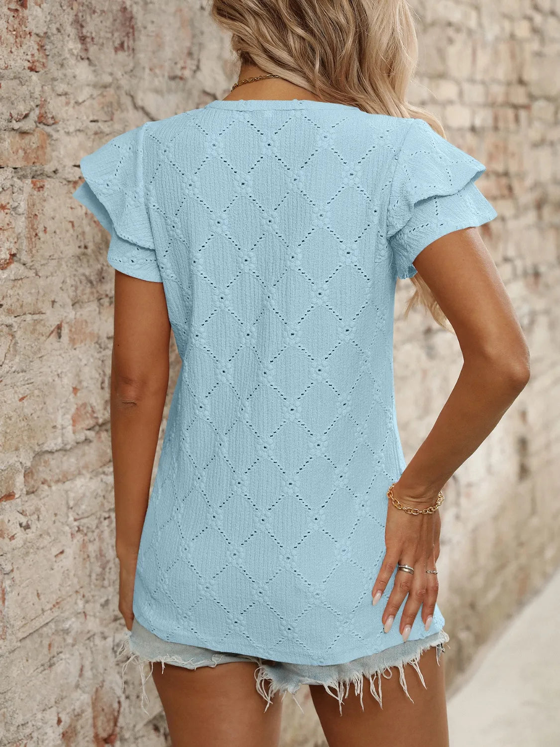 Eyelet V-Neck Ruffled Cap Sleeve Top - Premium Tops from Trendsi - Just $20.68! Shop now at Handbags Specialist Headquarter