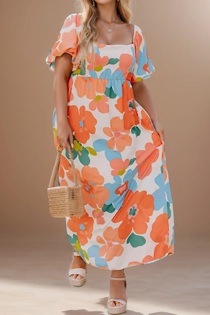 Plus Size Printed Short Sleeve Dress - Premium Dresses from Trendsi - Just $63.99! Shop now at Handbags Specialist Headquarter