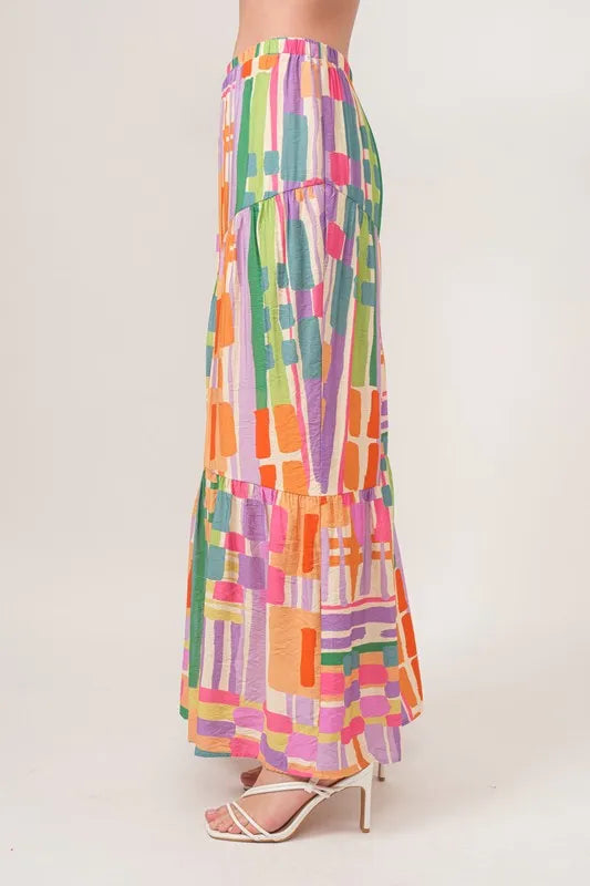 And The Why Asymmetric Geo Printed Tiered Maxi Skirt - Premium Skirts from Trendsi - Just $47.99! Shop now at Handbags Specialist Headquarter