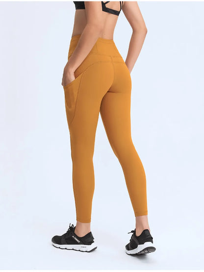Millennia Wide Waistband Leggings with Pockets - Premium Leggings from Trendsi - Just $67.08! Shop now at Handbags Specialist Headquarter