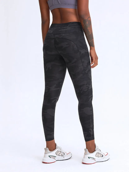 Millennia Wide Waistband Leggings with Pockets - Premium Leggings from Trendsi - Just $67.08! Shop now at Handbags Specialist Headquarter