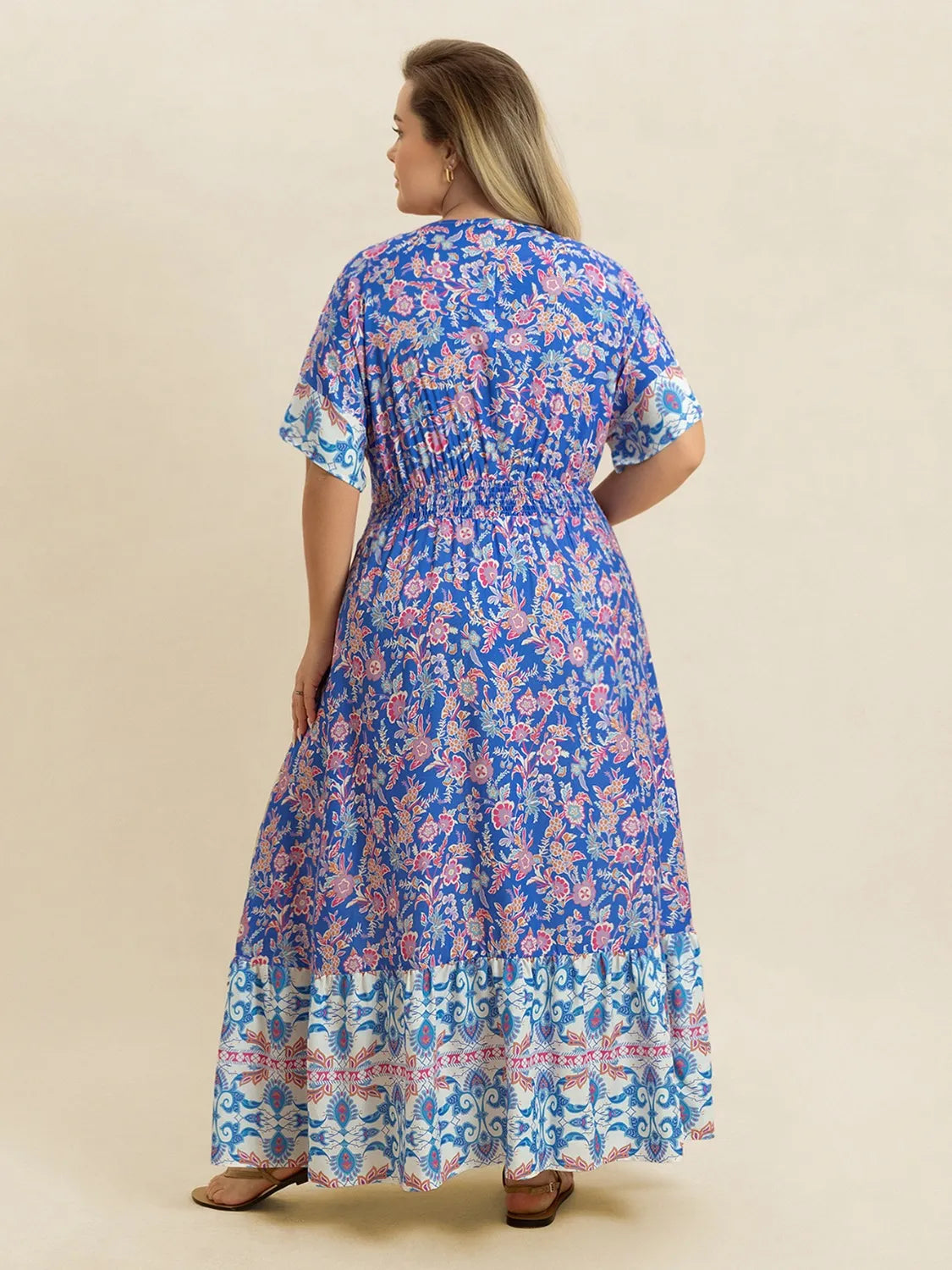 Plus Size Smocked Printed Half Sleeve Midi Dress - Premium Dresses from Trendsi - Just $43.99! Shop now at Handbags Specialist Headquarter