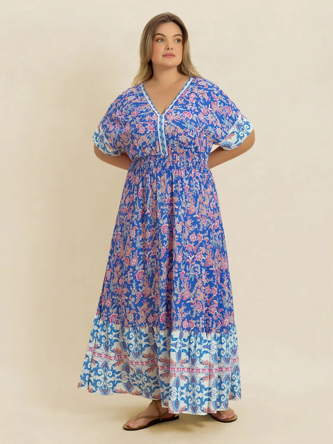 Plus Size Smocked Printed Half Sleeve Midi Dress - Premium Dresses from Trendsi - Just $43.99! Shop now at Handbags Specialist Headquarter