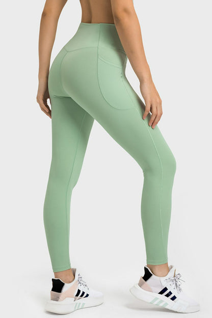 Millennia V-Waist Yoga Leggings with Pockets - Premium Leggings from Trendsi - Just $59.76! Shop now at Handbags Specialist Headquarter