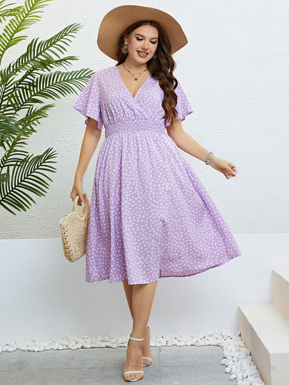Honey Plus Size Printed Smocked Waist Surplice Dress - Premium Dresses from Trendsi - Just $32.99! Shop now at Handbags Specialist Headquarter