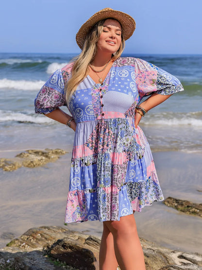 Plus Size Printed V-Neck Tiered Mini Dress - Premium Dresses from Trendsi - Just $33.99! Shop now at Handbags Specialist Headquarter
