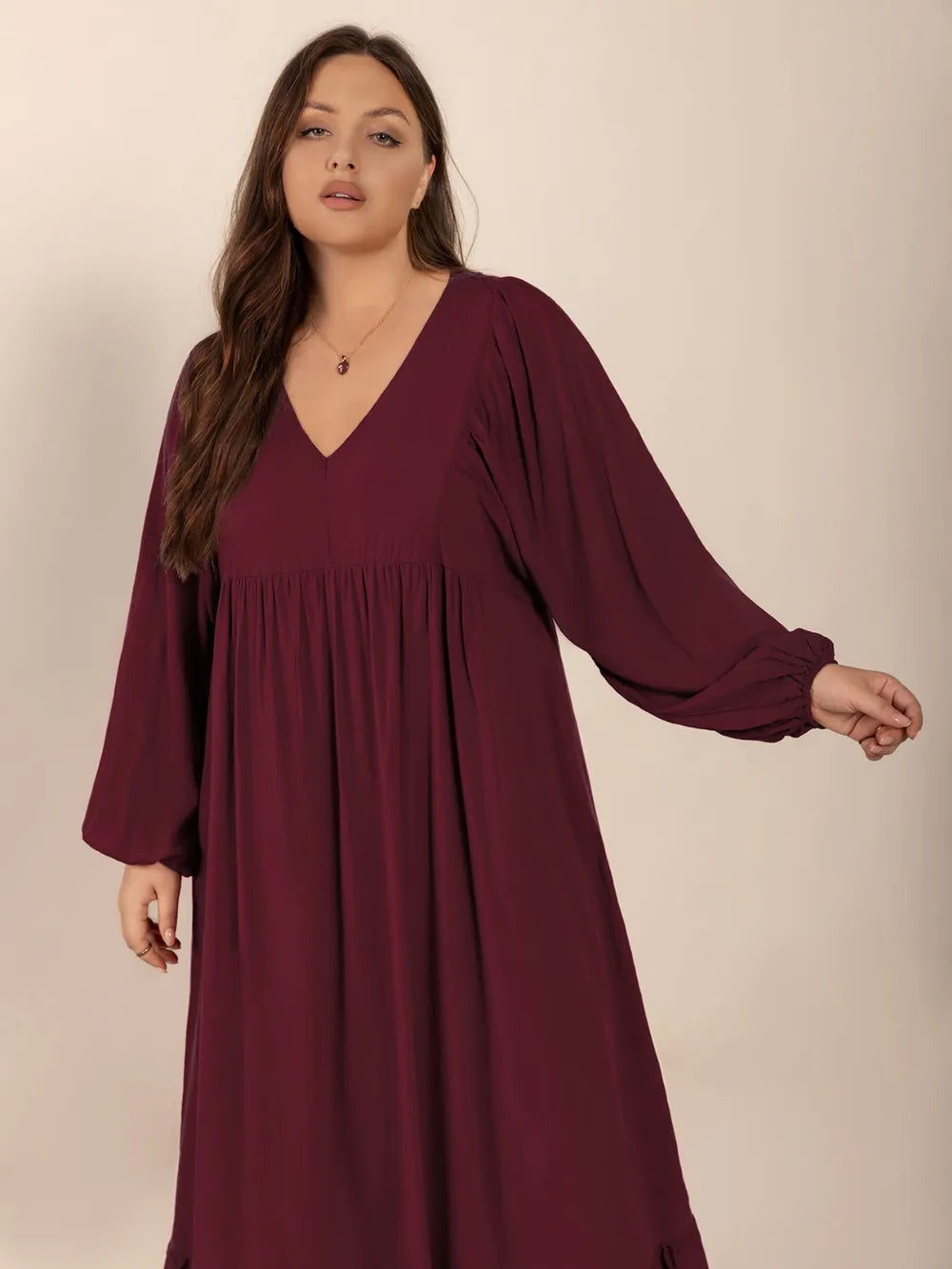 Plus Size Ruffled Hem V-Neck Balloon Sleeve Dress - Premium Dresses from Trendsi - Just $38.99! Shop now at Handbags Specialist Headquarter