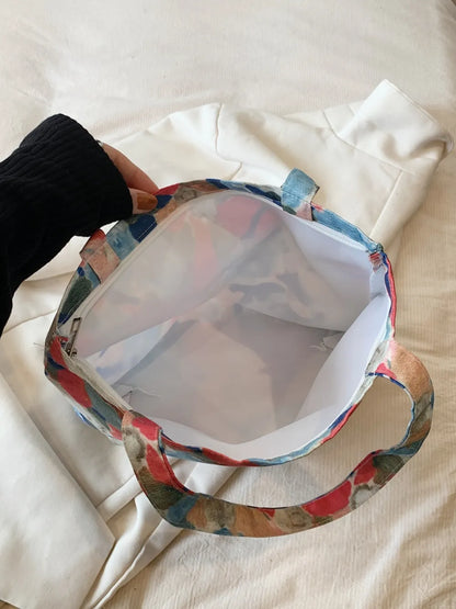 Printed Canvas Handbag with Zipper - Premium Handbags from Trendsi - Just $21.99! Shop now at Handbags Specialist Headquarter