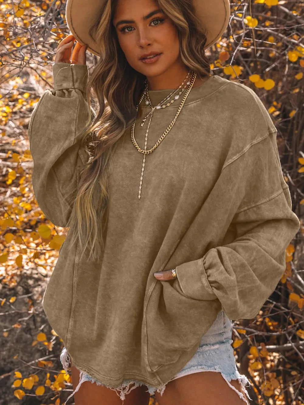 Exposed Seam Twisted V-Neck Sweatshirt - Premium Women's sweatshirts from Trendsi - Just $58.99! Shop now at Handbags Specialist Headquarter