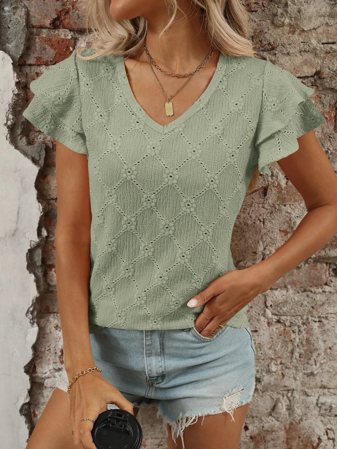 Eyelet V-Neck Ruffled Cap Sleeve Top - Premium Tops from Trendsi - Just $20.68! Shop now at Handbags Specialist Headquarter
